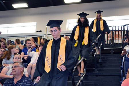 Lemoore Middle College High School enter Friday's graduation ceremony via the bleachers to Pomp and Circumstance.